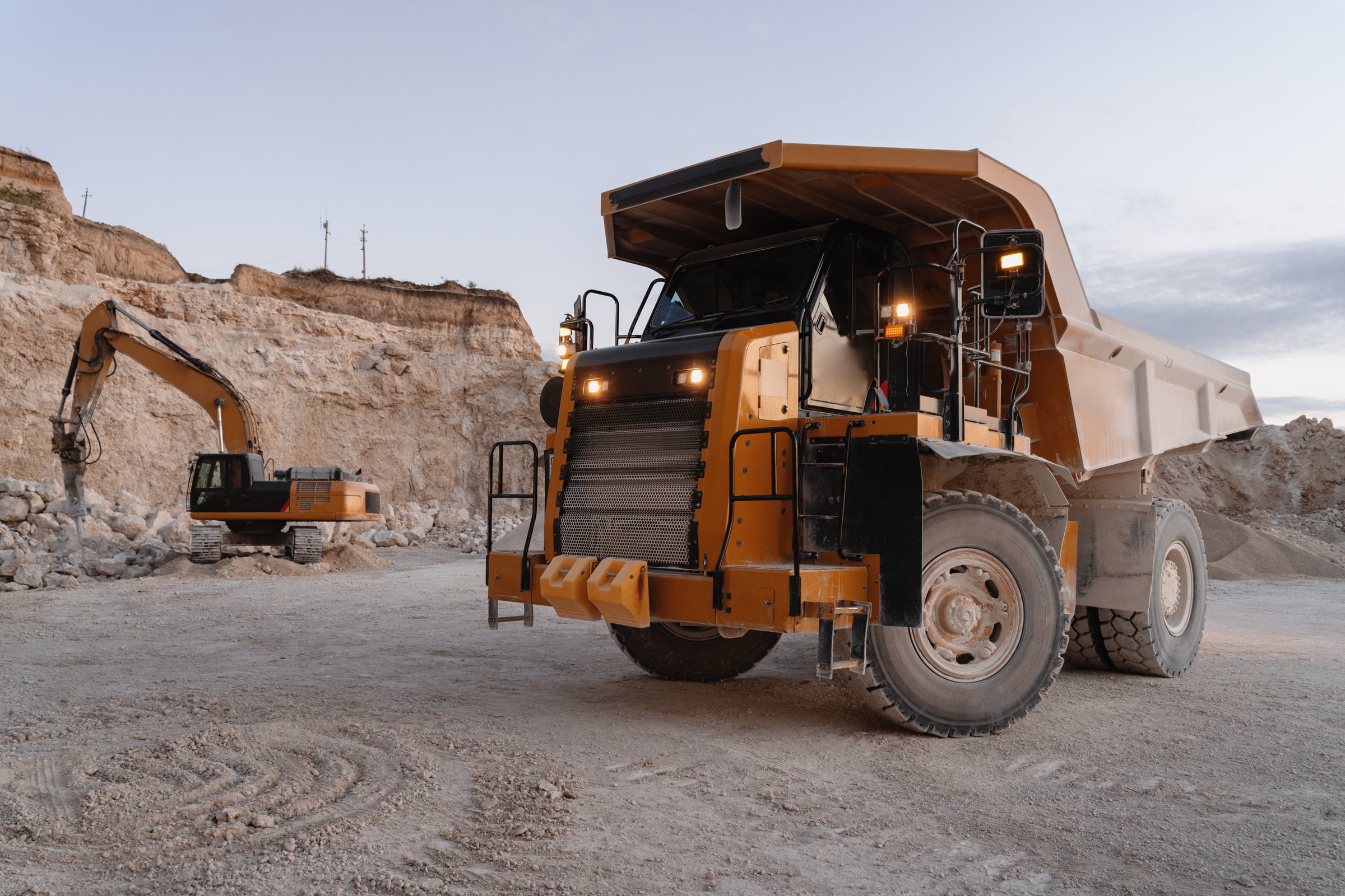 Dump truck and excavator working together