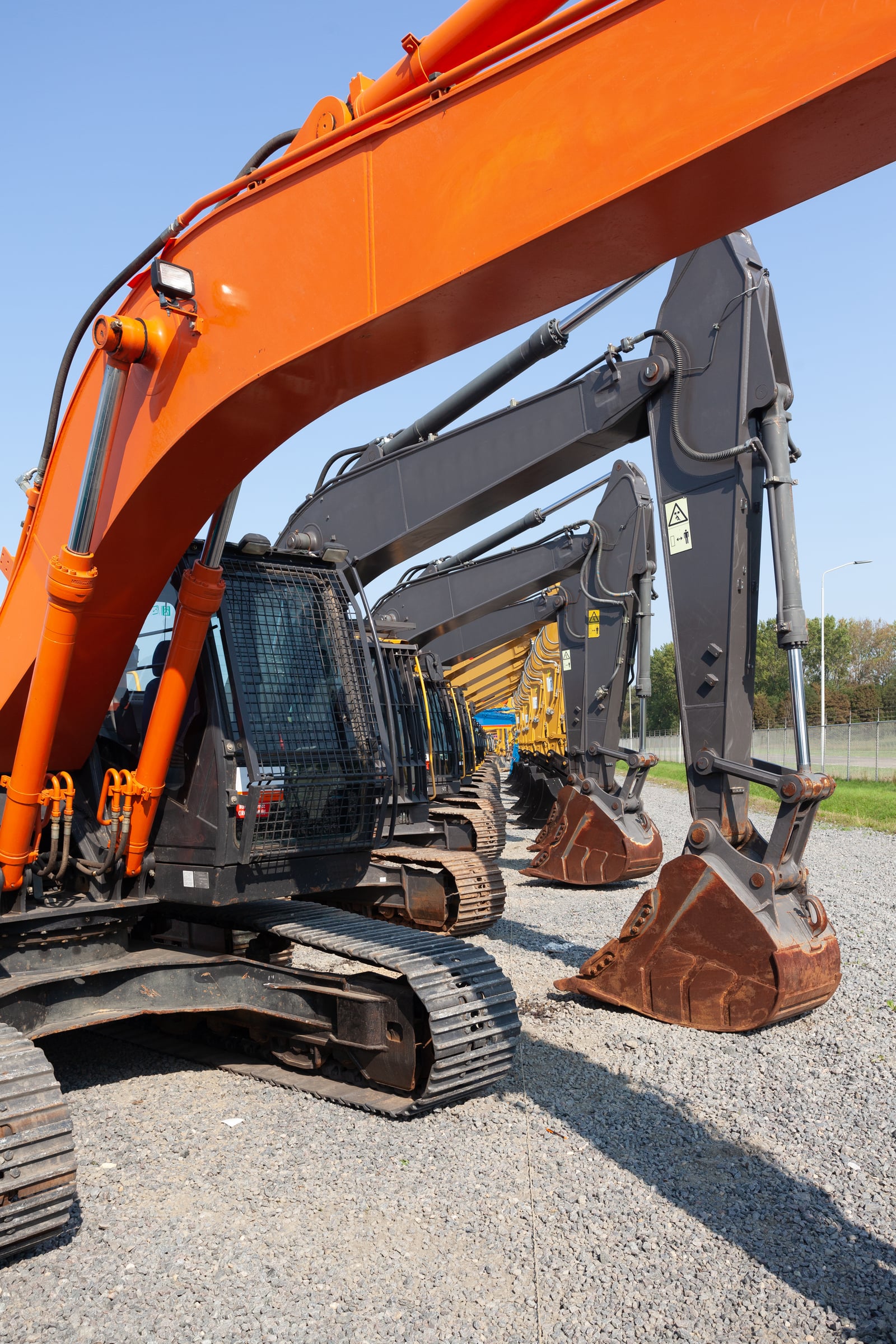 Row of excavators at construction site